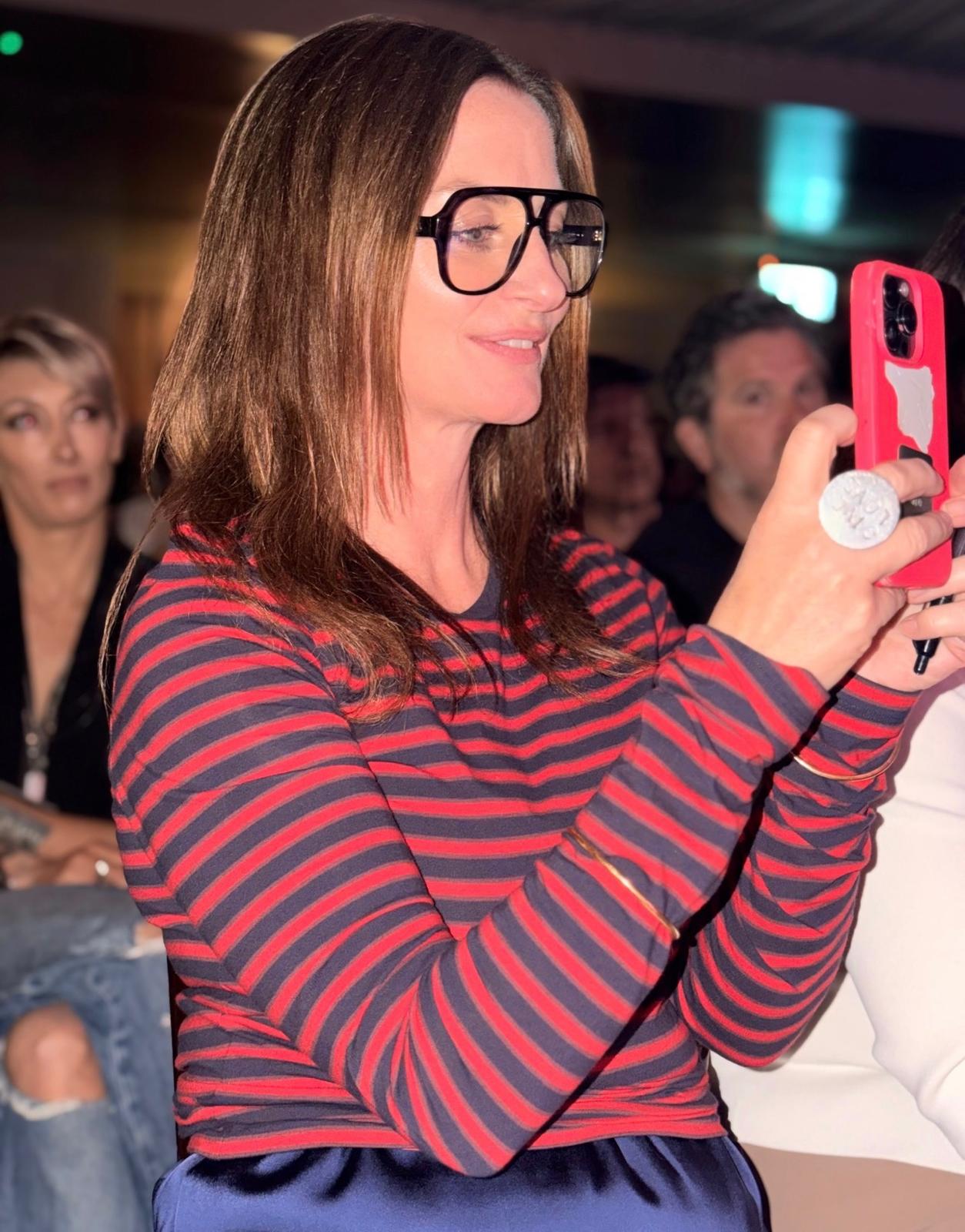 A guest capturing a Prime Time Reset event on her phone